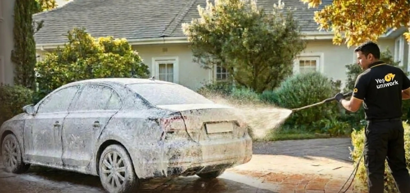 YES Uniwork expert foam-washing a car in a driveway