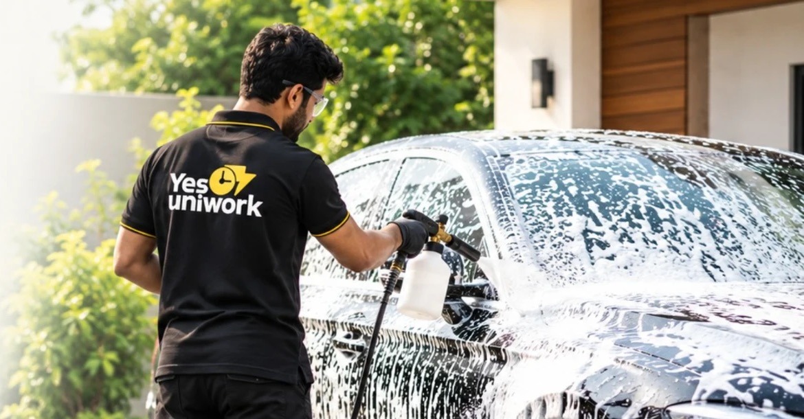 YES Uniwork expert foam-washing a black car